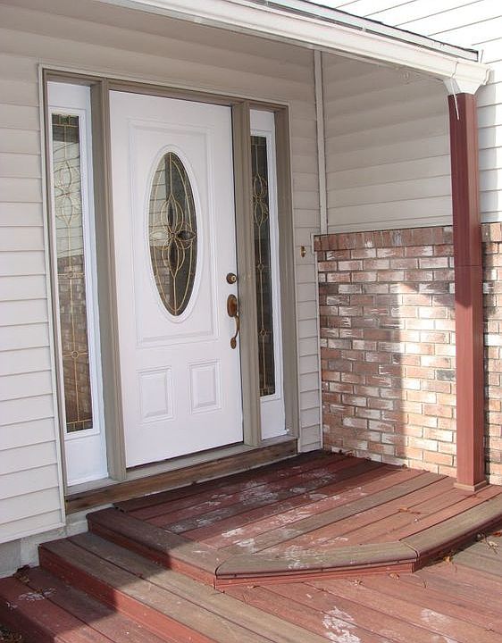 This inside the door is a large landing with a coat closet.