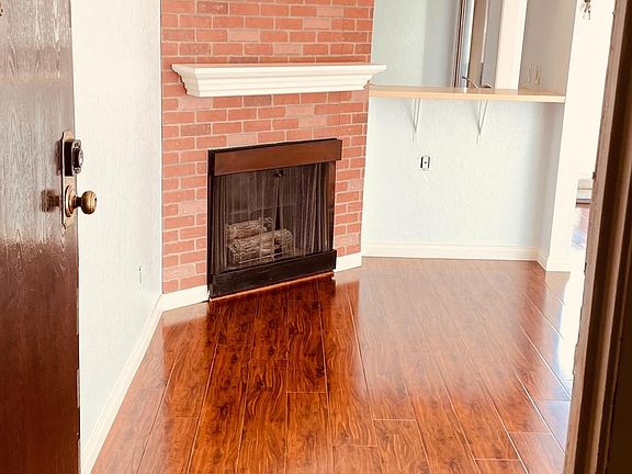 So much Natural Light & Gorgeous Fireplace greet you!