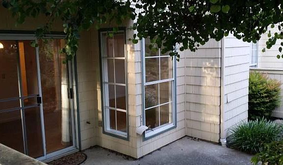 Back patio overlooking lagoon, accessible from dining room slider doors.