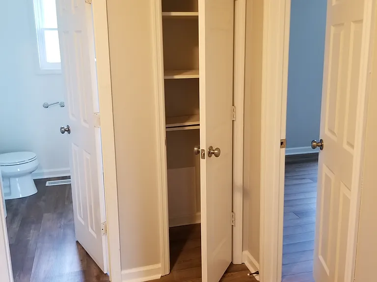 Upstairs, view of closet, bathroom and master bedroom