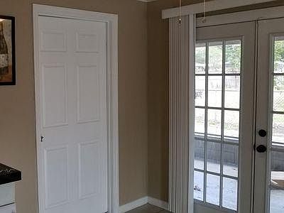 French doors to enclosed screen patio 