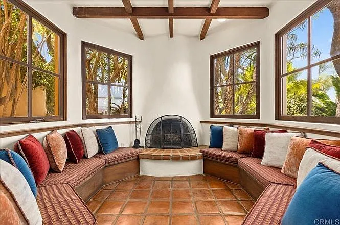 Downstairs fireplace nook can seat around 10 people.