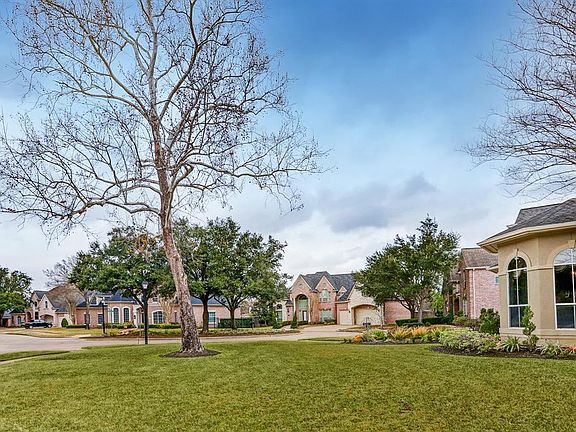 Located on cul de sac oversized (17438 sq foot lot) with mature trees is this upgraded Custom home in gated Bayou Oaks section of master planned community of Cinco Ranch.