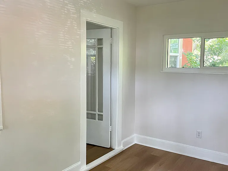 Bonus space with view to the door that leads to the living room.