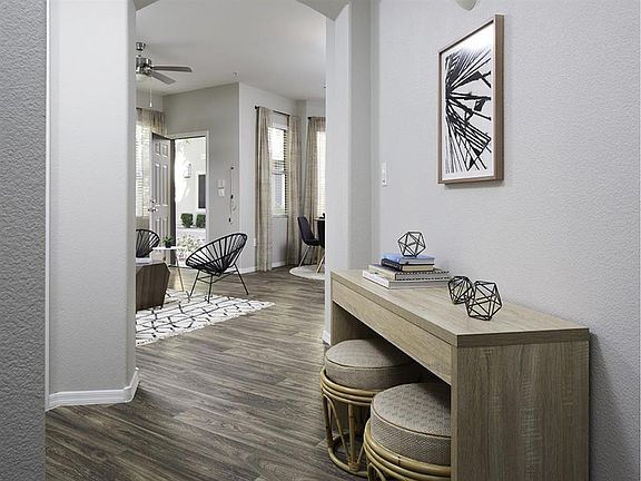 Wood-inspired flooring runs through out the living spaces of