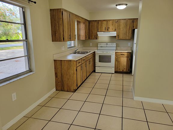 Standing front door looking thru dining area into kitchen