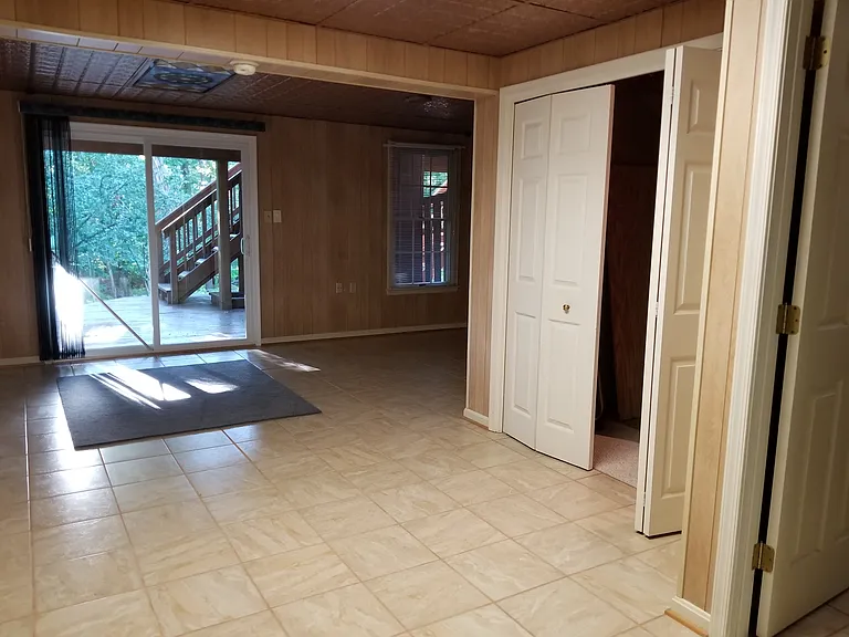 Walk out basement and family room, entrance to workshop area.