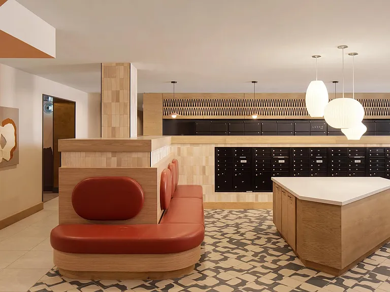A thoughtfully designed mail lounge with warm finishes and modern lighting_every detail considered at Modera Rio Salado.