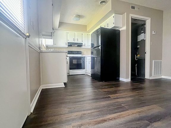 This shows dining room, kitchen and laundry room.