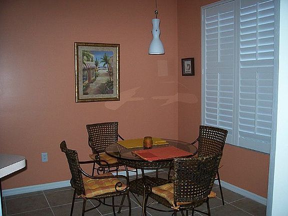 Breakfast room with plantation shutters overlooking lake