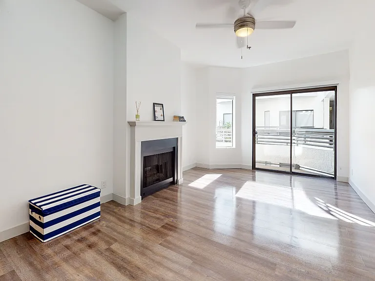 Bright lit open floor plans featuring sustainable hardwood flooring.