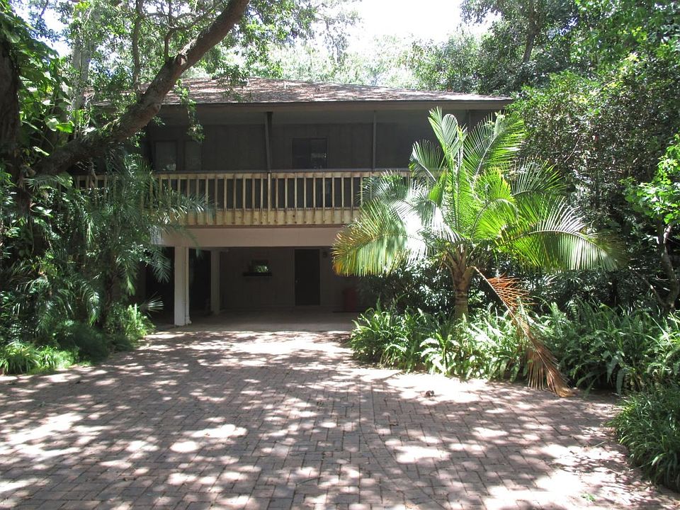 view of Tree house and underneath carport in tropical settin