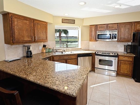 The Kitchen boasts granite countertops, stainless steel appliances