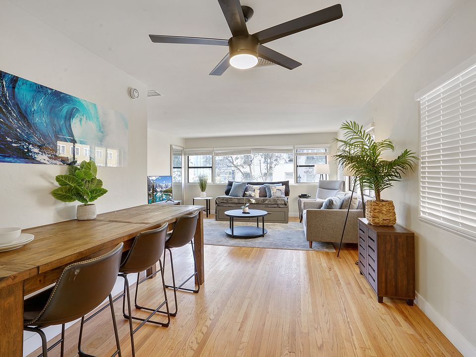 entryway and dining area with view of the living room