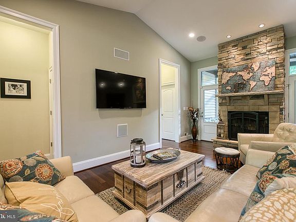Floor to Ceiling Stone Woodburning Fireplace