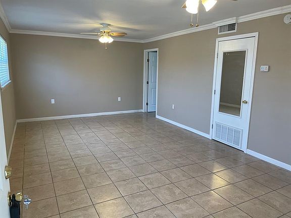 Spacious Living/Dining room with tile floors, Ceiling Fans, and Low-e Insulated Windows