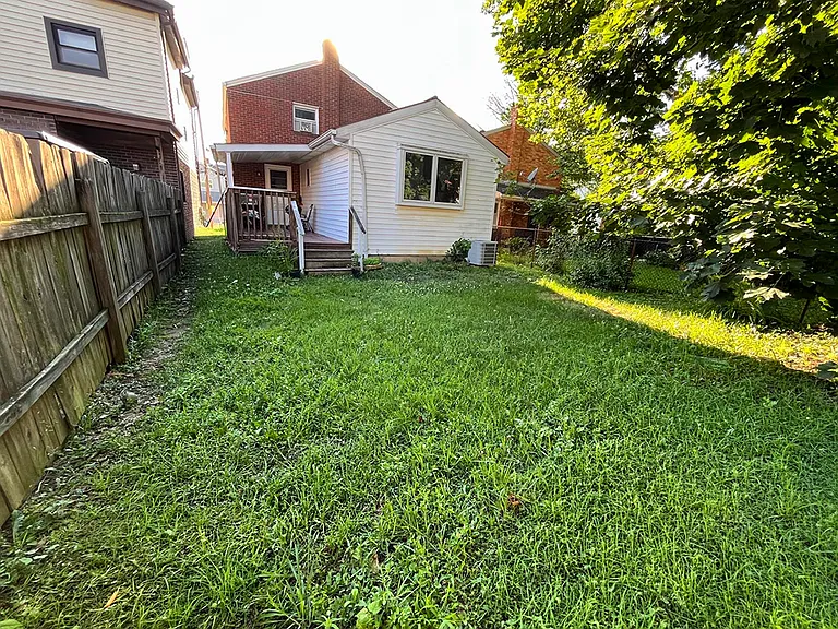 Large, fenced in backyard