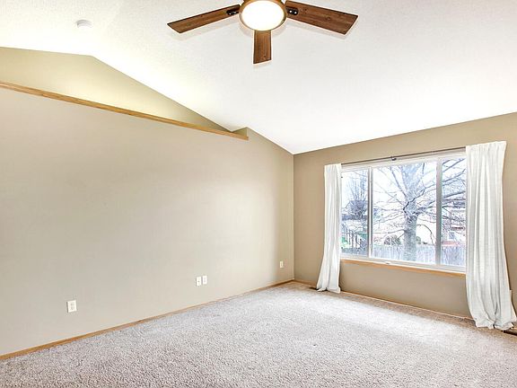 Living room with picture window to backyard
