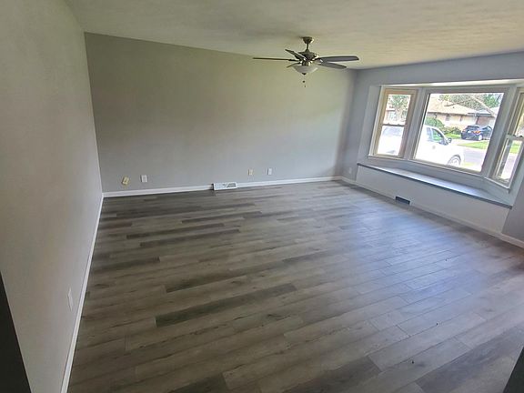 large family room with large bay window.