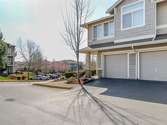 Enter thru your attached garage on the right and directly into your one level unit, no steps anywhere! Bonus... park your second car right outside your garage.