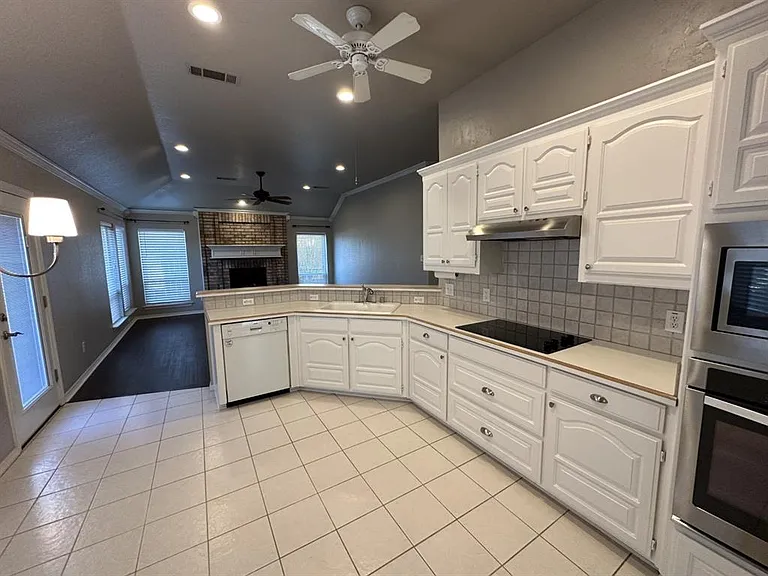 Additional view of kitchen and living space.
