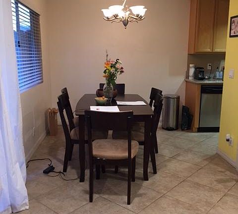 Dining area adjacent to kitchen and overlooking outdoor private patio
