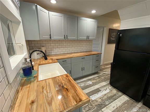 Custom countertops and spacious farmhouse sink.