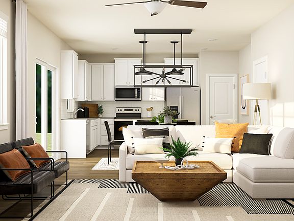 Rendering of a family room that sits adjacent to a kitchen with white cabinets.