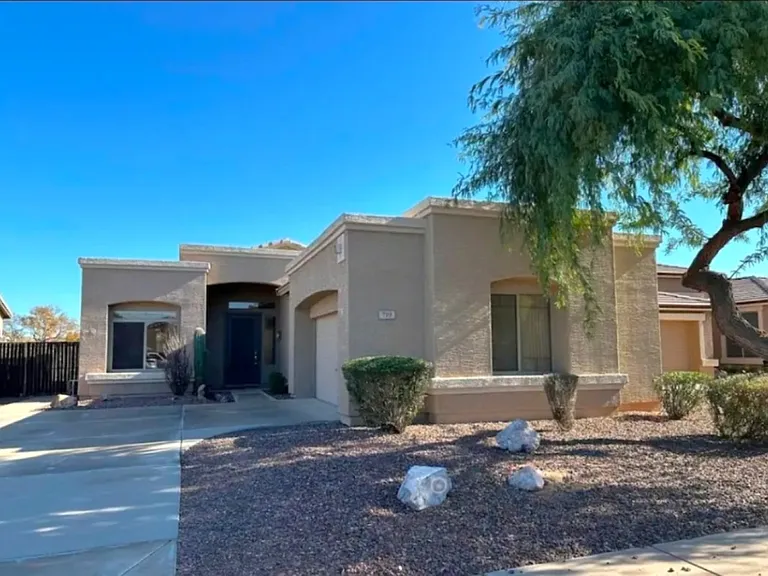 Outside view of home with large driveway, beautifully angled garage for an upgraded look.