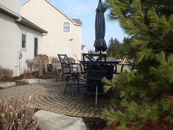 2-tier patio surrounded by landscape