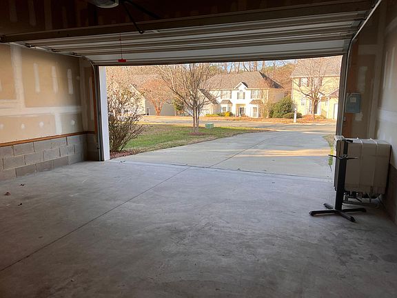 Two car garages w/flat long driveway