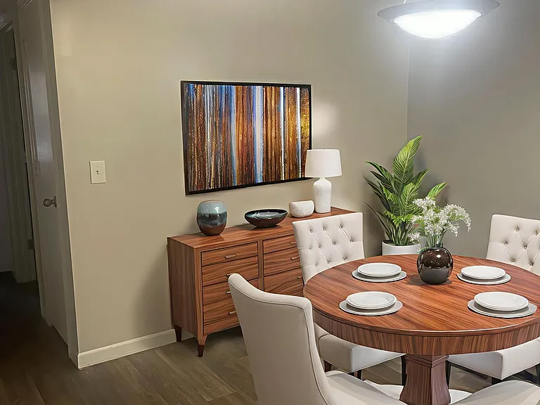 Explore the inviting ambiance of Riverwood Park Apartments, where modern design meets comfort. The stylish dining area is perfect for gatherings, complemented by chic decor. Ready to elevate your living experience? Inquire today!