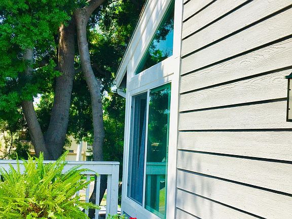 Spacious patio outside front door with view to greenbelt