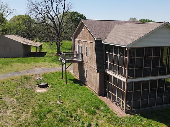 Two bedroom, 1.5 bath home with upper and lower screen porches, two car garage, and approximately 896 heated sqft upper level living area.