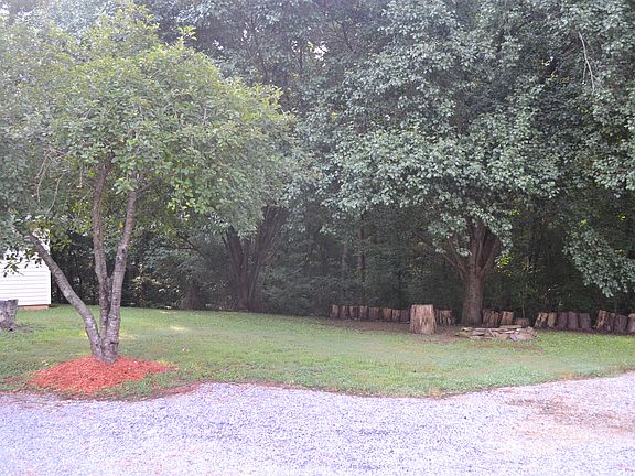 Level yard, woods on 3 sides