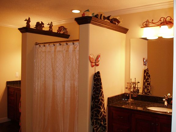 Bathroom upstairs in teenagers retreat, double vanities granite countertops