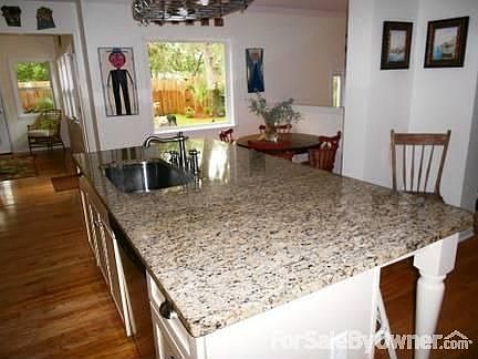 Breakfast Nook with Large Fixed Window. Beautiful Granite Countertops.