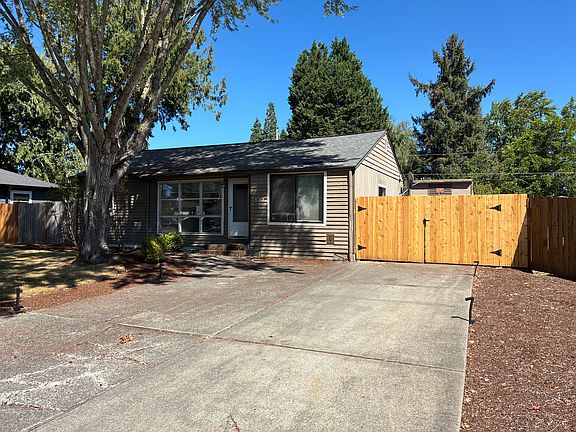 4 car driveway. Brand new gate to backyard.