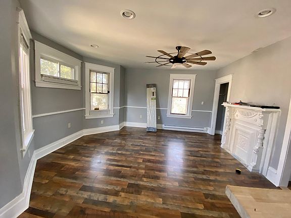 Living area with decorative fireplace.