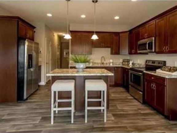 Photos of previously sold unit by same builder. Subject property to have similar finishes.