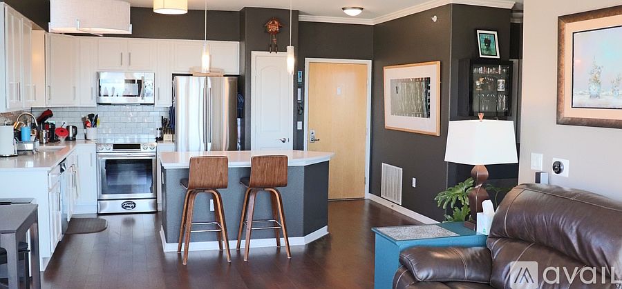 Kitchen and entrance into unit