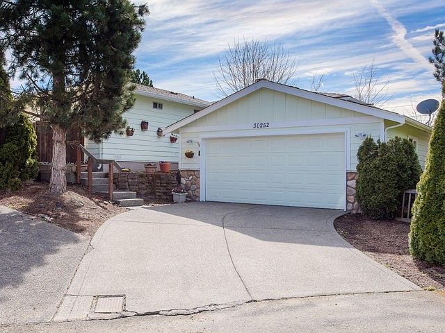 3+ bedrooms ~ 2 baths ~ approx. 2,140 square feet (including unfinished basement) in this 1950s styled home with two car garage . 
