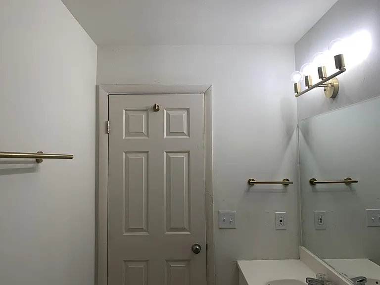 Upstairs bathroom facing door from shower