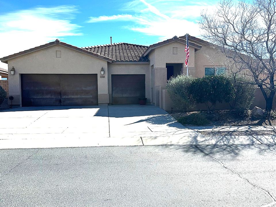 View of Front of house, gated courtyard, and 3 car garage