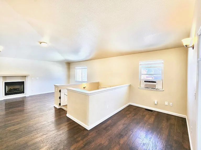 There is a place for playing, studying, office, or sitting area with an air-condition window. Next to it is the stairs to go to first floor, and next to it is the living room.