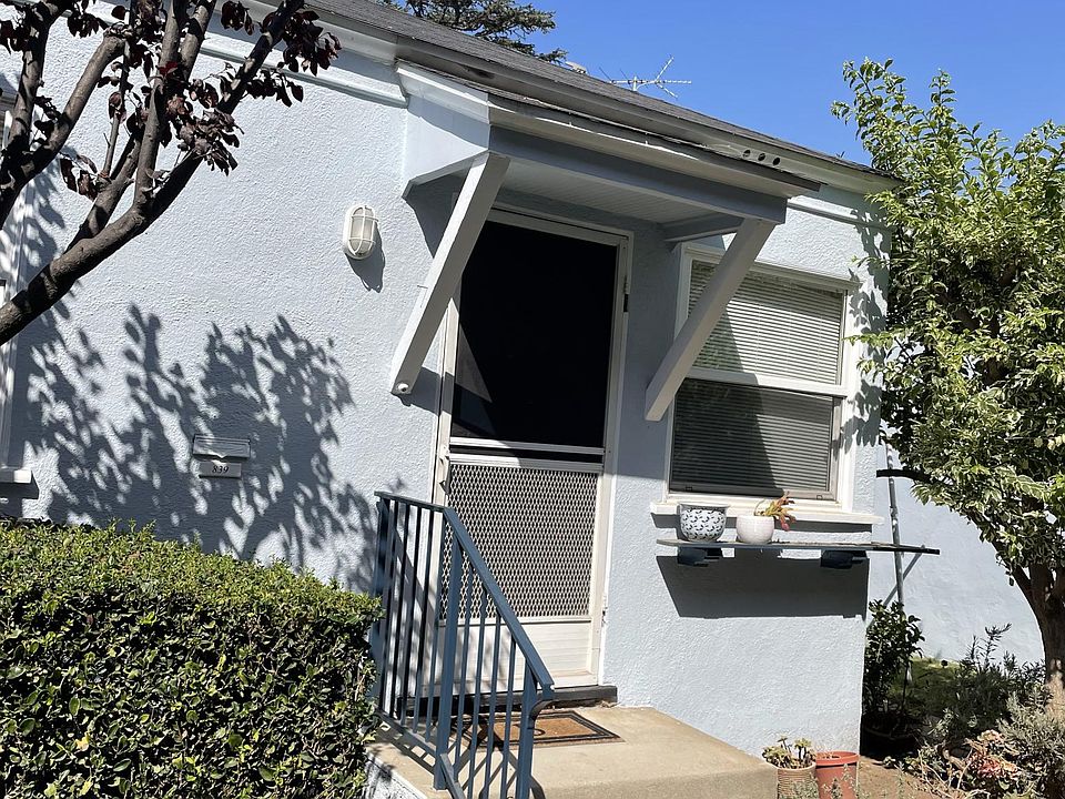 Unit entrance faces the side garden and walkway.