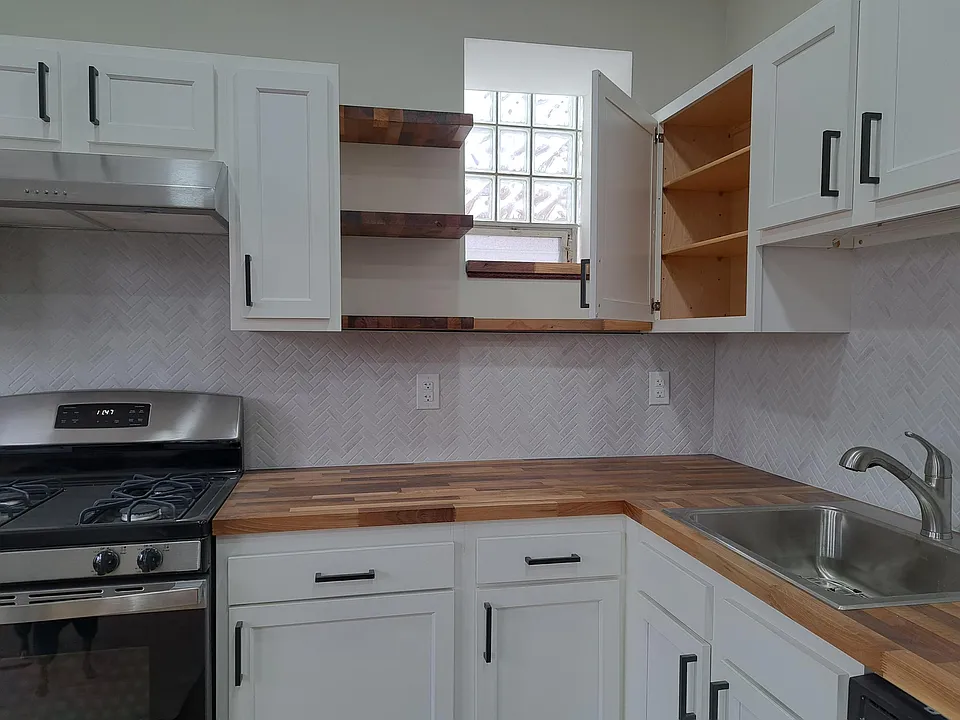 Custom butcherblock countertops and shelving, with under cabinet light