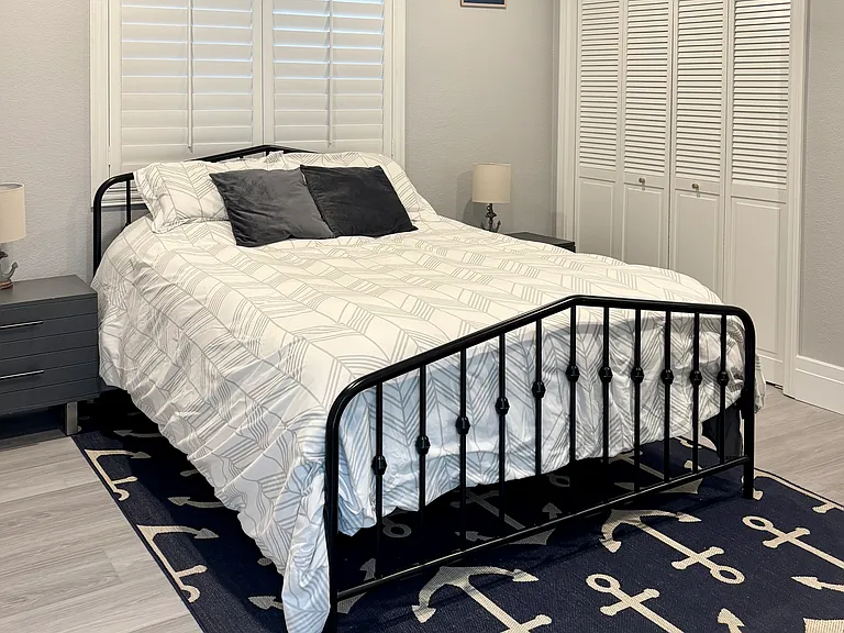Downstairs bedroom with queen bed