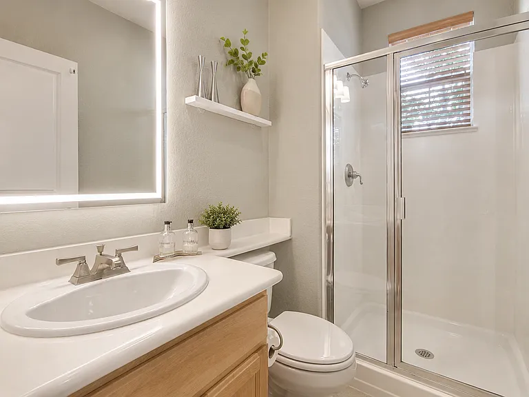 Downstairs bedroom with convenient access to a full bathroom.