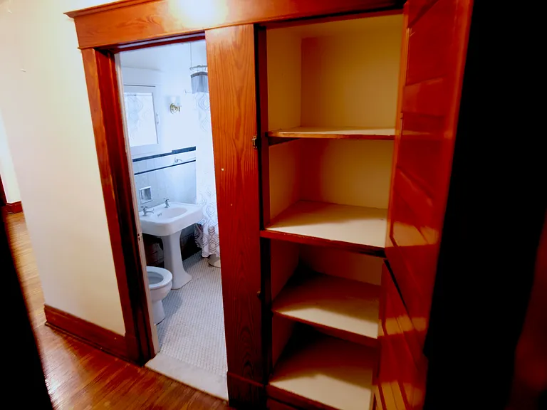 Original hardwood built-in cabinets provide a touch of charm.